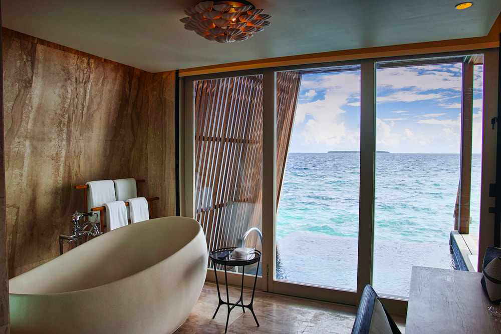 Luxurious tub with a view to the ocean. 